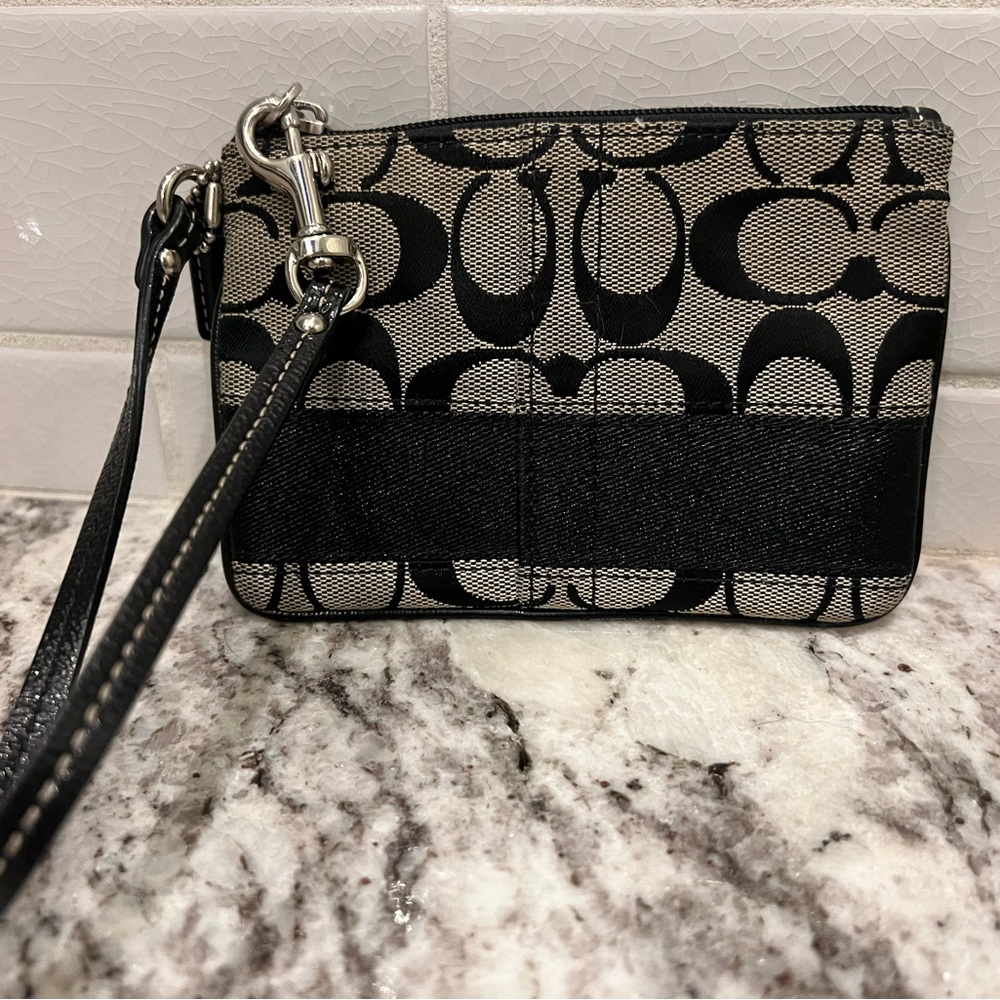 Coach signature print wristlet.